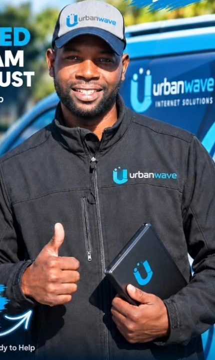 UrbanWave technician giving a thumbs-up beside a branded service vehicle